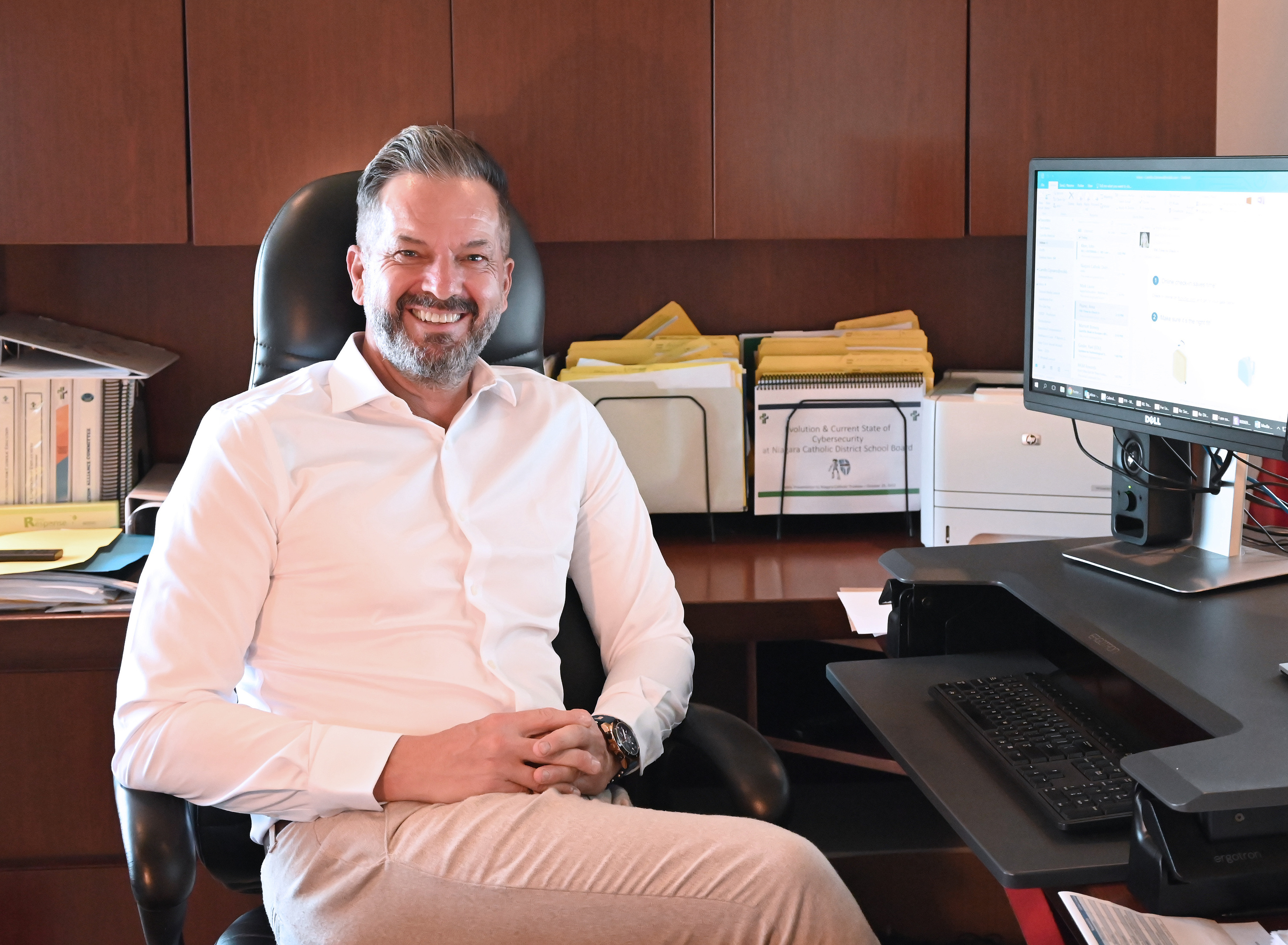 Director of Education Camillo Cipriano seated in his office.